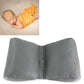 Dark gray newborn positioning cushion with curved shape and center seam