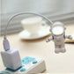 White astronaut USB LED desk light with lit helmet and USB cable