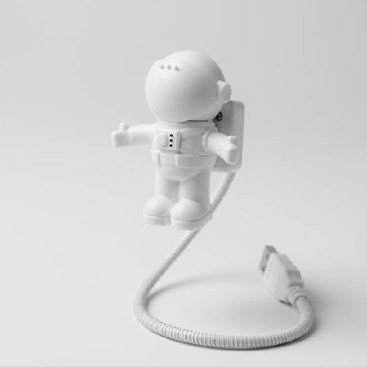 White astronaut USB LED desk lamp with glowing helmet and coiled USB cable