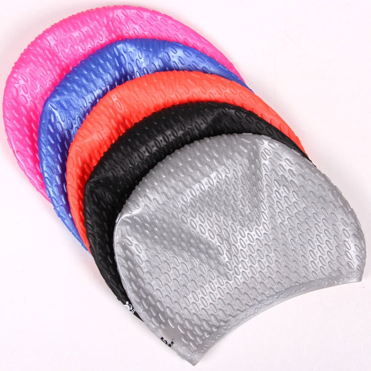Silicone swimming cap set showing gray, black, orange, blue, and pink water-drop texture