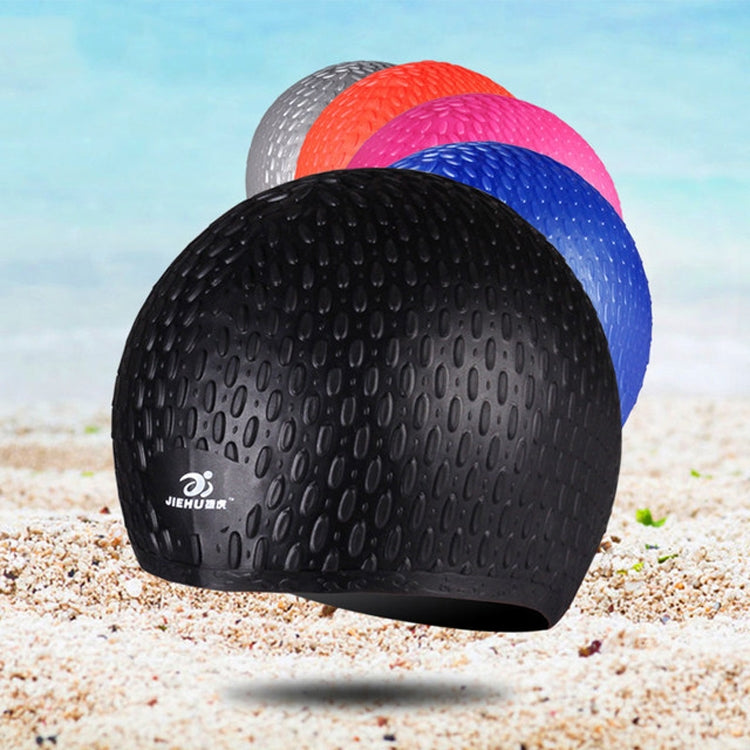Black silicone swimming cap with water-drop texture, with other colors stacked behind