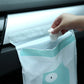 Light aqua car garbage bag with cartoon bear face and 'Nice every day' label