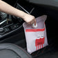 Pink car garbage bag with cartoon face and 'Nice every day' print on seat