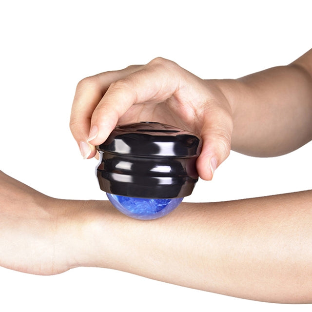 Blue massage roller ball massager held against forearm, black outer case.