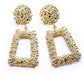 Gold-tone geometric trapezoid long dangle earrings with textured round tops