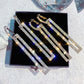 Assorted rhinestone long rectangle drop earrings set with blue, silver, and gold tones