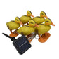 Yellow duck solar stake light set with orange bases and attached clear connection wire
