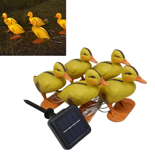 Solar duck stake lights set: yellow ducks with orange bases and solar panel module