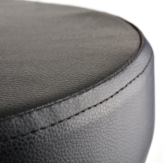 Black round padded seat with stitched leather-look upholstery detail
