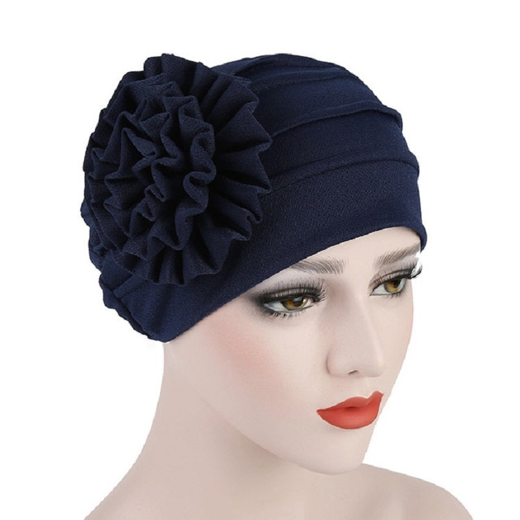 Women’s navy turban hat with side rosette flower detail, adjustable fit