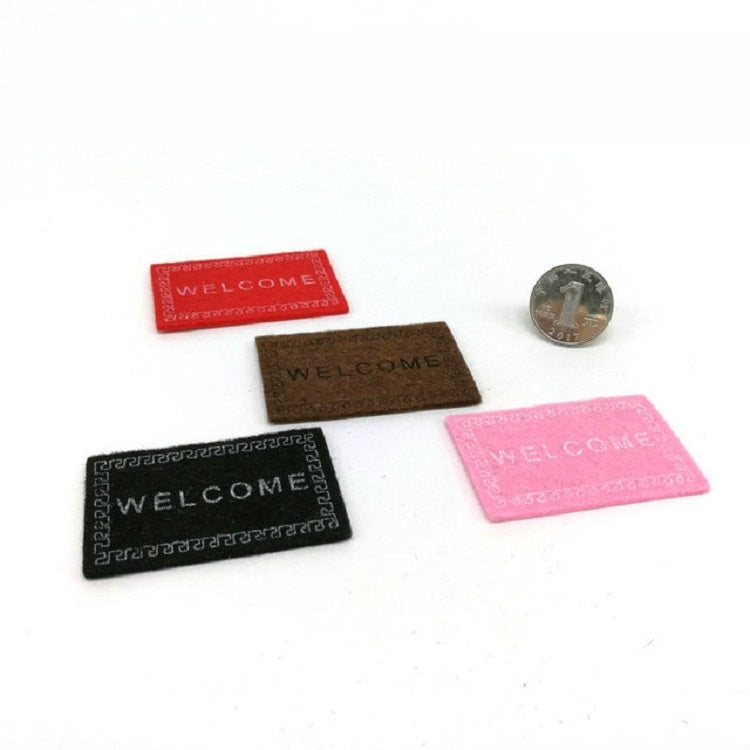 Assorted mini dollhouse welcome mats in red, brown, black, and pink
