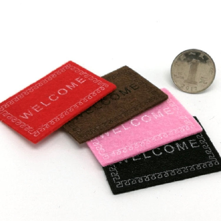 Mini welcome mats bundle in red, brown, pink, and black with 'WELCOME'