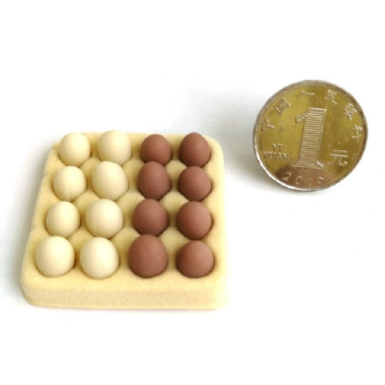 Mini egg carton toy with 16 molded eggs, yellow tray holding white and brown egg pieces