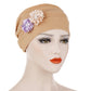 Khaki linen turban hat wrap with floral accents on the front crown