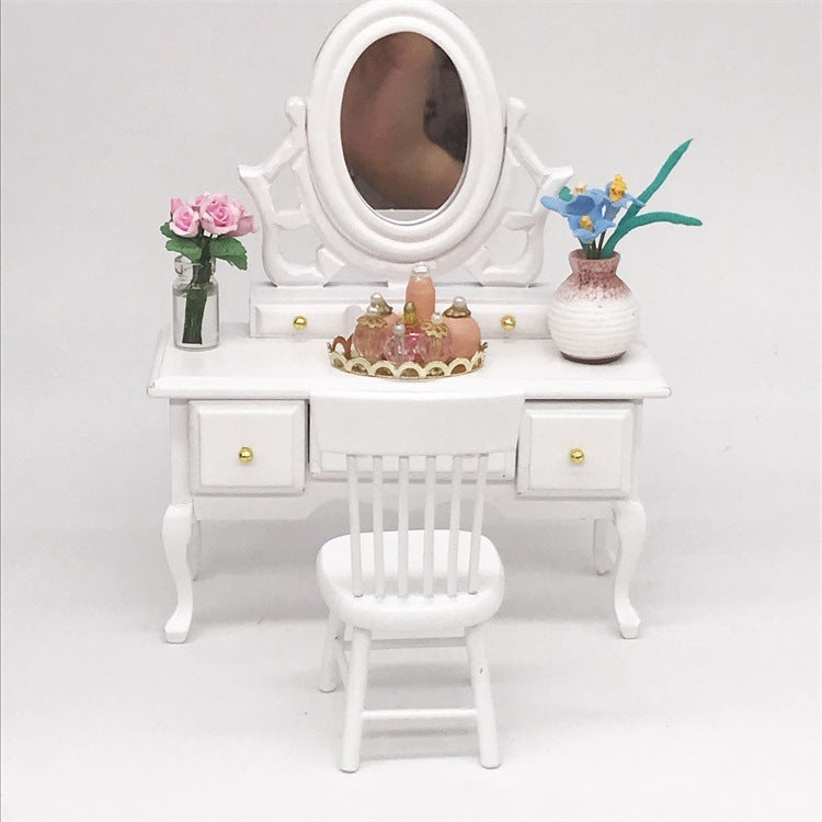 White doll dressing table with mirror, chair, and mini cosmetic set on top