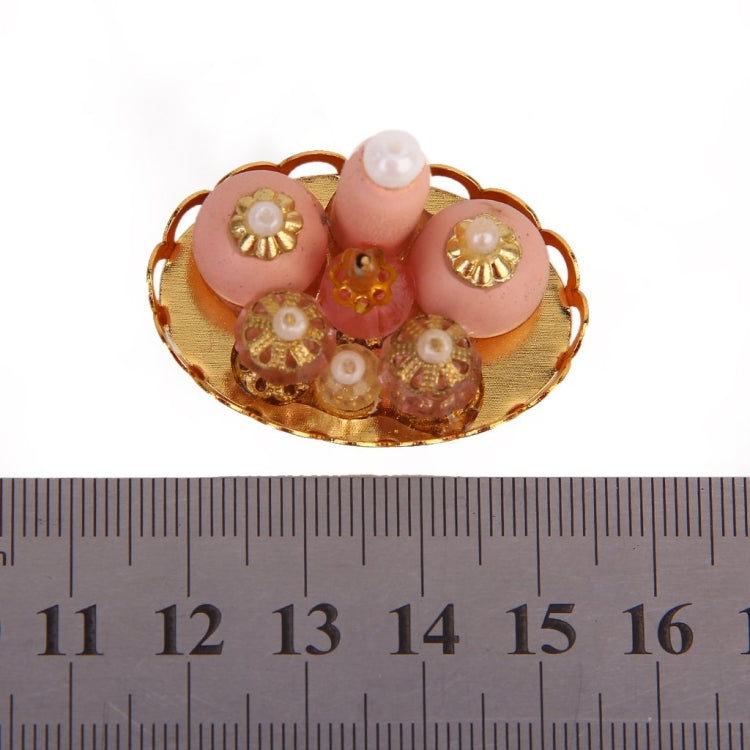 Mini doll house cosmetic bottles on oval gold tray, pink and clear details