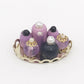 Mini doll house cosmetic set with purple bottles and pearl tops on gold tray