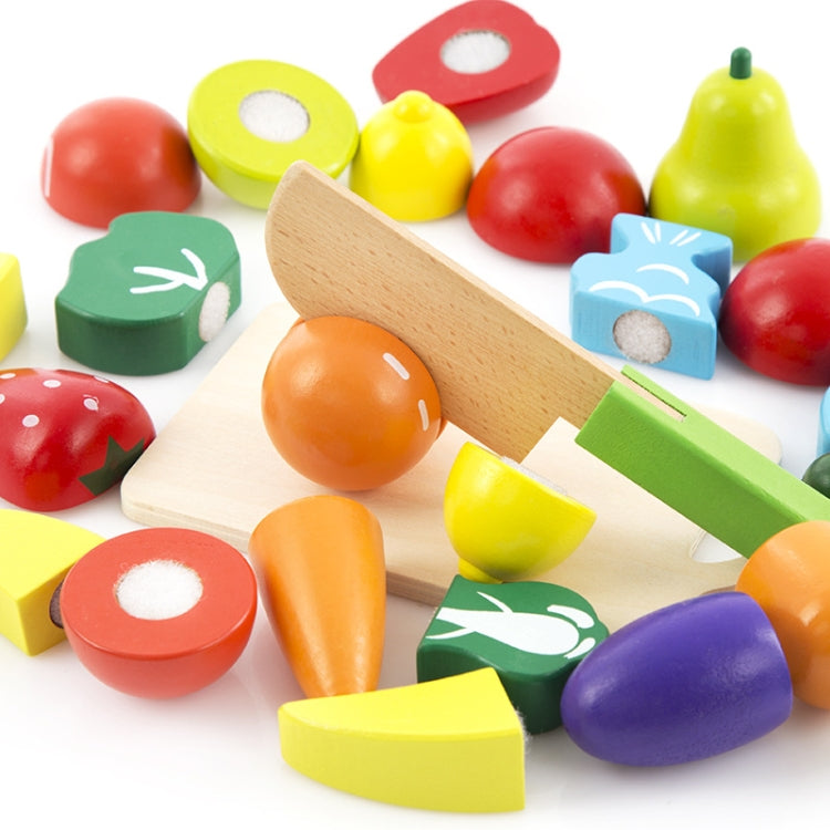 Wooden cutting toy with mixed fruit and vegetable pieces plus slicing board