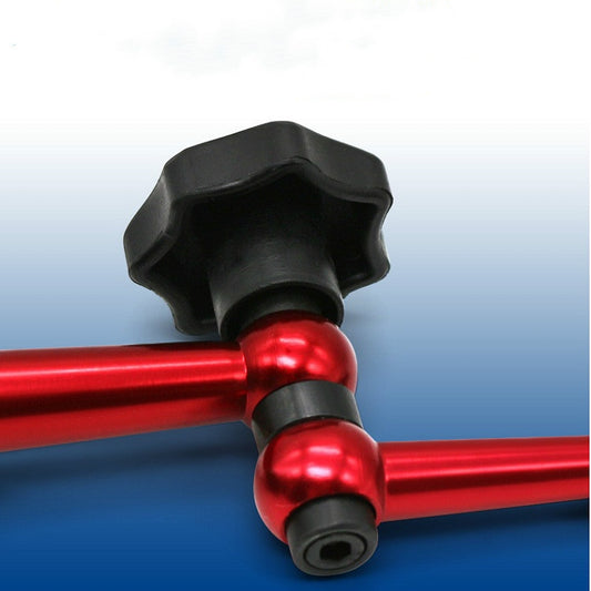 Close-up of red magnetic stand arm with black adjustment knobs
