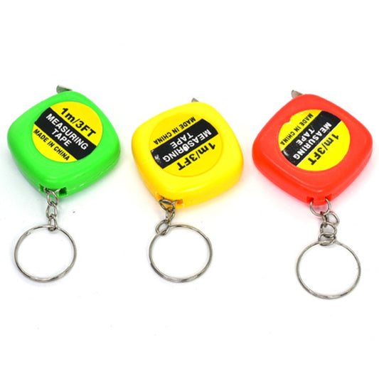 Assorted retractable square tape measure key rings in green, yellow, and red with metal loops