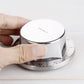 Magnetic timer top in hand over stainless numbered countdown dial