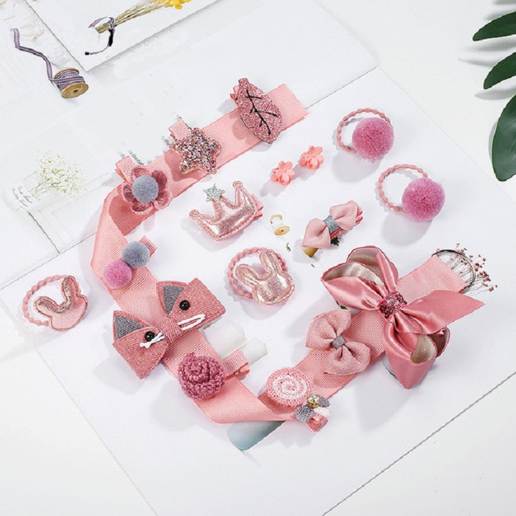 Girls hair accessories set with pink bow clips, pom-pom bands, and hair ties