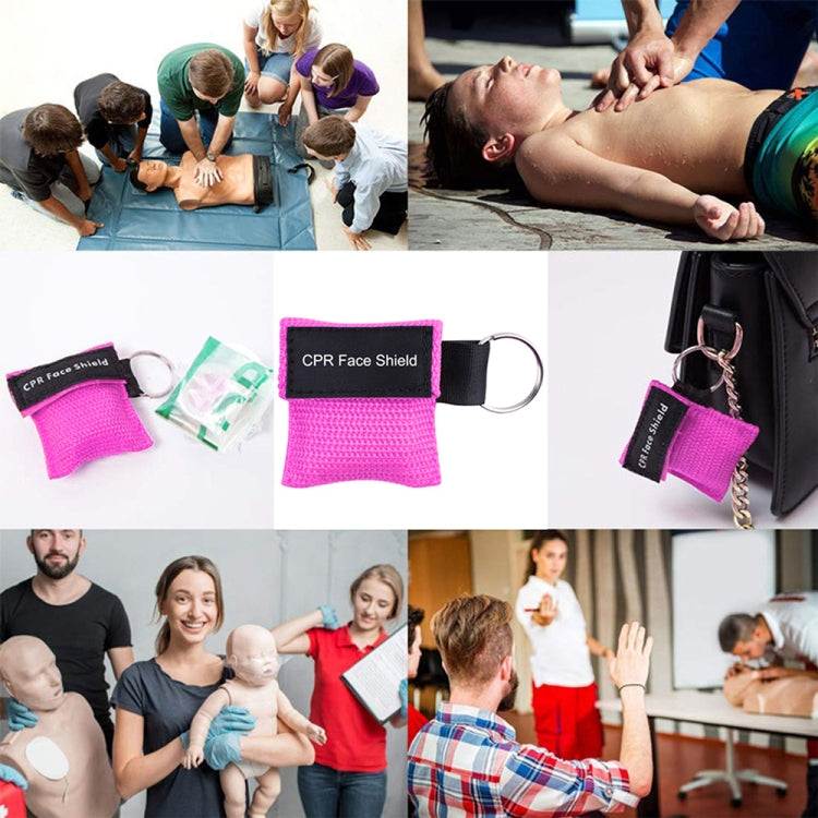 Pink CPR face shield pouch with key ring, shown with small mask pieces