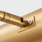 Gold floor lamp spotlight arm connector with visible screws and mounting bracket.