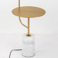 Round gold top floor lamp with white marble cylinder base and curved gold support.