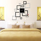 Black square wall clock with mirrored square stickers arranged around it