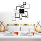 Black square wall clock with silver hands surrounded by mirrored square stickers