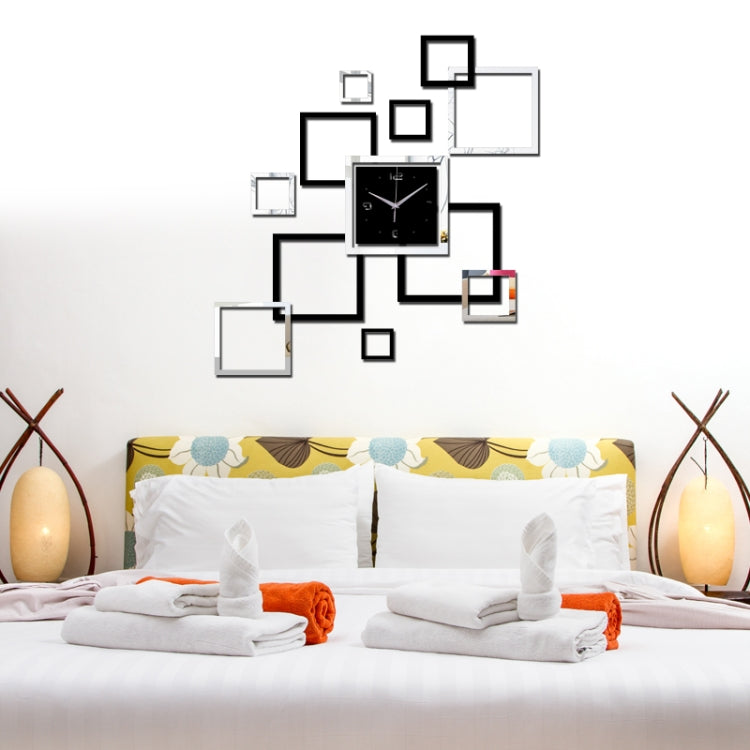 Black square wall clock with silver hands surrounded by mirrored square stickers