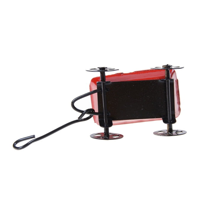 Mini red and black metal pull cart with side supports and red tray