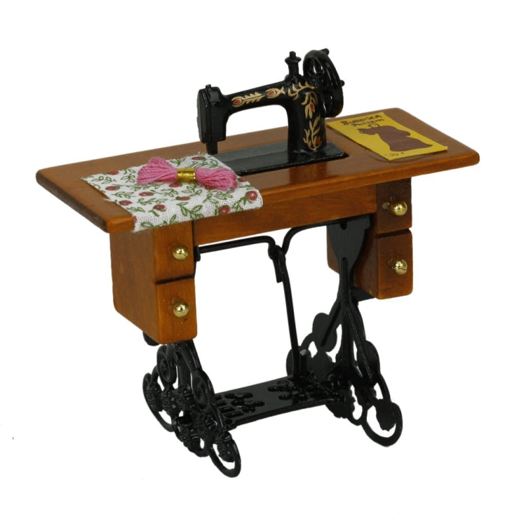 Mini sewing machine dollhouse table with floral fabric and black metal frame