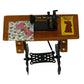 Mini sewing machine dollhouse table with floral fabric, yellow card, and black frame