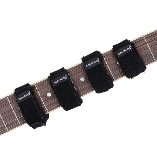 Multiple black string damper bands on a guitar fretboard