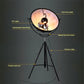Black tripod floor lamp with circular shade and labeled parts diagram