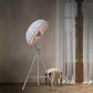 White tripod floor lamp with circular dome shade and tripod legs