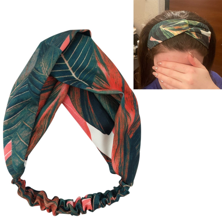 Green and teal leaf-pattern cross-knot turban headband with red highlights
