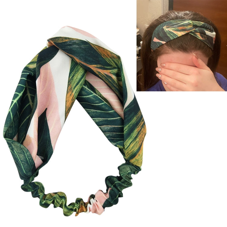 Leaf-print cross-knot turban headband with pink stripe detail and ruffled edge