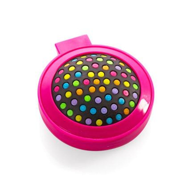 Pink folding massage mirror comb with round polka-dot brush head under mirror cover