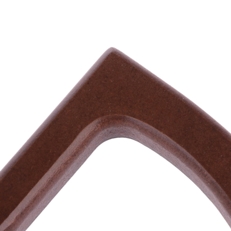 Curved dark brown wooden handle end piece with arched cutout