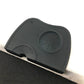 Dark gray/black corner coffee pad with round embossed textured insert and side notch.