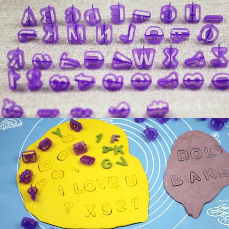 Purple cookie letter and number molds pressed into fondant dough