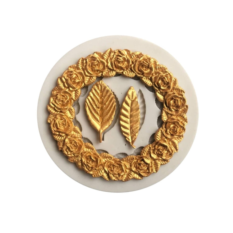 Circular silicone mold insert with rose garland ring and three leaf impressions
