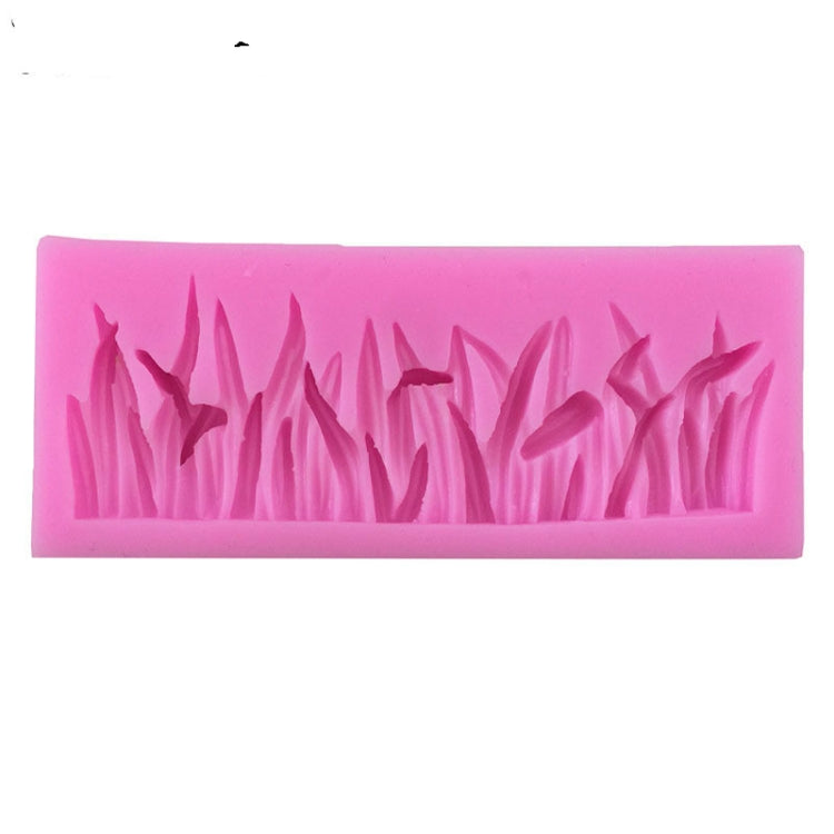 Pink silicone grass shape mold with detailed grass blade cavities for fondant