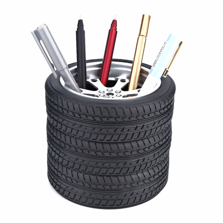 Black tire-style wheel pen holder with pens and pencils inserted