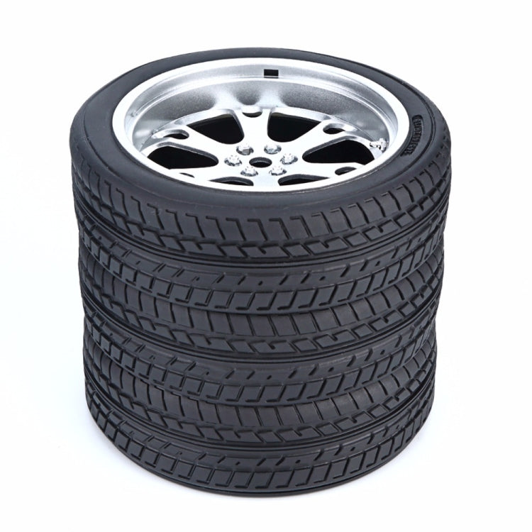 Black tire wheel pen holder with silver hub opening
