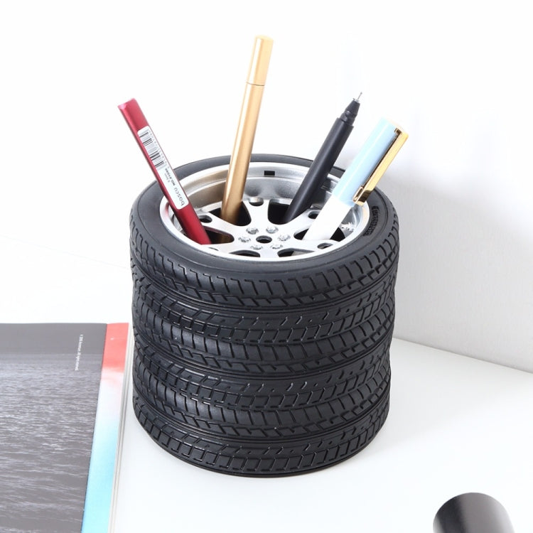 Black tire wheel pen holder with colorful pencils and pens