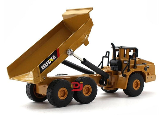 Tan alloy articulated dump truck toy with tipping bed raised and cab detail visible